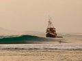 The Bulan Baru waiting patiently while a guest surfs.